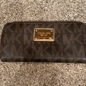 Brown and Gold Michael Kors accordion wallet.